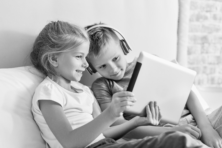 Child on iPad wearing headphones